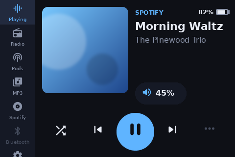 Now playing, with the cover, big buttons and the battery badge.